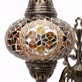 Close-up of Amber warm amber mosaic glass globe pattern — wall sconce (ENV APN3089)