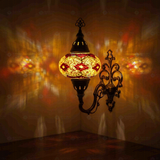 Amber Turkish mosaic wall sconce illuminated, showing colorful light projection (ENV APN3092)