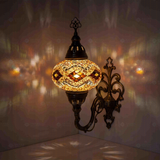 Amber Turkish mosaic wall sconce illuminated, showing colorful light projection (ENV APN3097)