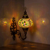 Multicolor Turkish mosaic wall sconce illuminated, showing colorful light projection (ENV APN3099)