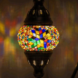 Lit close-up of mosaic glass globe — Multicolor table lamp glowing (ENV DVN1061)