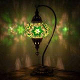 Green Turkish mosaic table lamp illuminated, showing colorful light projection (ENV DVN3003)