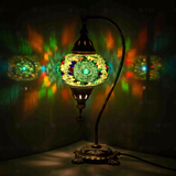 Green Turkish mosaic table lamp illuminated, showing colorful light projection (ENV DVN3006)