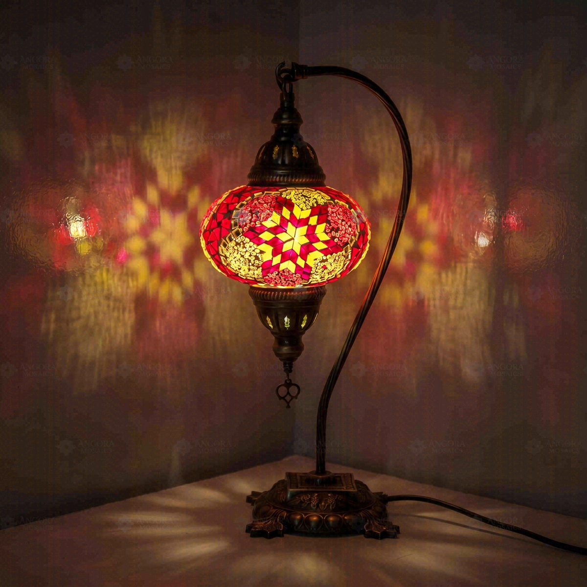 Pink Swan Neck Table Lamp, switched on, glowing in a dark room