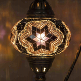 Lit close-up of mosaic glass globe — Warm Tones table lamp glowing (ENV DVN3019)