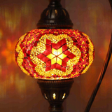Lit close-up of mosaic glass globe — Amber table lamp glowing (ENV DVN3025)