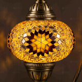 Lit close-up of mosaic glass globe — Amber table lamp glowing (ENV DVN3026)