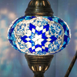 Lit close-up of mosaic glass globe — Blue table lamp glowing (ENV DVN3039)
