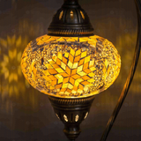 Lit close-up of mosaic glass globe — Amber table lamp glowing (ENV DVN3043)