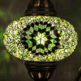 Lit close-up of mosaic glass globe — Green table lamp glowing (ENV DVN3048)