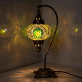 Green Turkish mosaic table lamp illuminated, showing colorful light projection (ENV DVN3050)