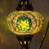 Lit close-up of mosaic glass globe — Green table lamp glowing (ENV DVN3050)