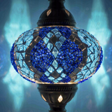 Lit close-up of mosaic glass globe — Blue table lamp glowing (ENV DVN3053)