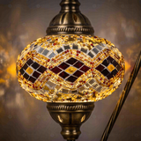Lit close-up of mosaic glass globe — Amber table lamp glowing (ENV DVN3057)