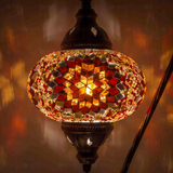 Lit close-up of mosaic glass globe — Amber table lamp glowing (ENV DVN3065)