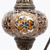 Close-up of Amber warm amber mosaic glass globe pattern — table lamp (ENV DVN3089)