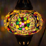 Lit close-up of mosaic glass globe — Multicolor table lamp glowing (ENV DVN3099)