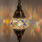 Lit close-up of mosaic glass globe — Multicolor pendant light glowing (ENV DYN1010)