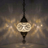 White Turkish mosaic pendant light illuminated, showing colorful light projection (ENV DYN2001)