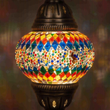 Lit close-up of mosaic glass globe — Multicolor pendant light glowing (ENV DYN2003)