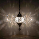 White Turkish mosaic pendant light illuminated, showing colorful light projection (ENV DYN2017)