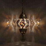 Clear Turkish mosaic pendant light illuminated, showing colorful light projection (ENV DYN2025)