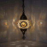 Amber Turkish mosaic pendant light illuminated, showing colorful light projection (ENV DYN2118)