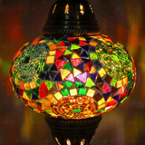 Lit close-up of mosaic glass globe — Multicolor pendant light glowing (ENV DYN3001)
