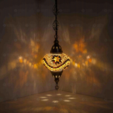 Amber Turkish mosaic pendant light illuminated, showing colorful light projection (ENV DYN3009)