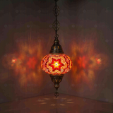 Amber Turkish mosaic pendant light illuminated, showing colorful light projection (ENV DYN3025)
