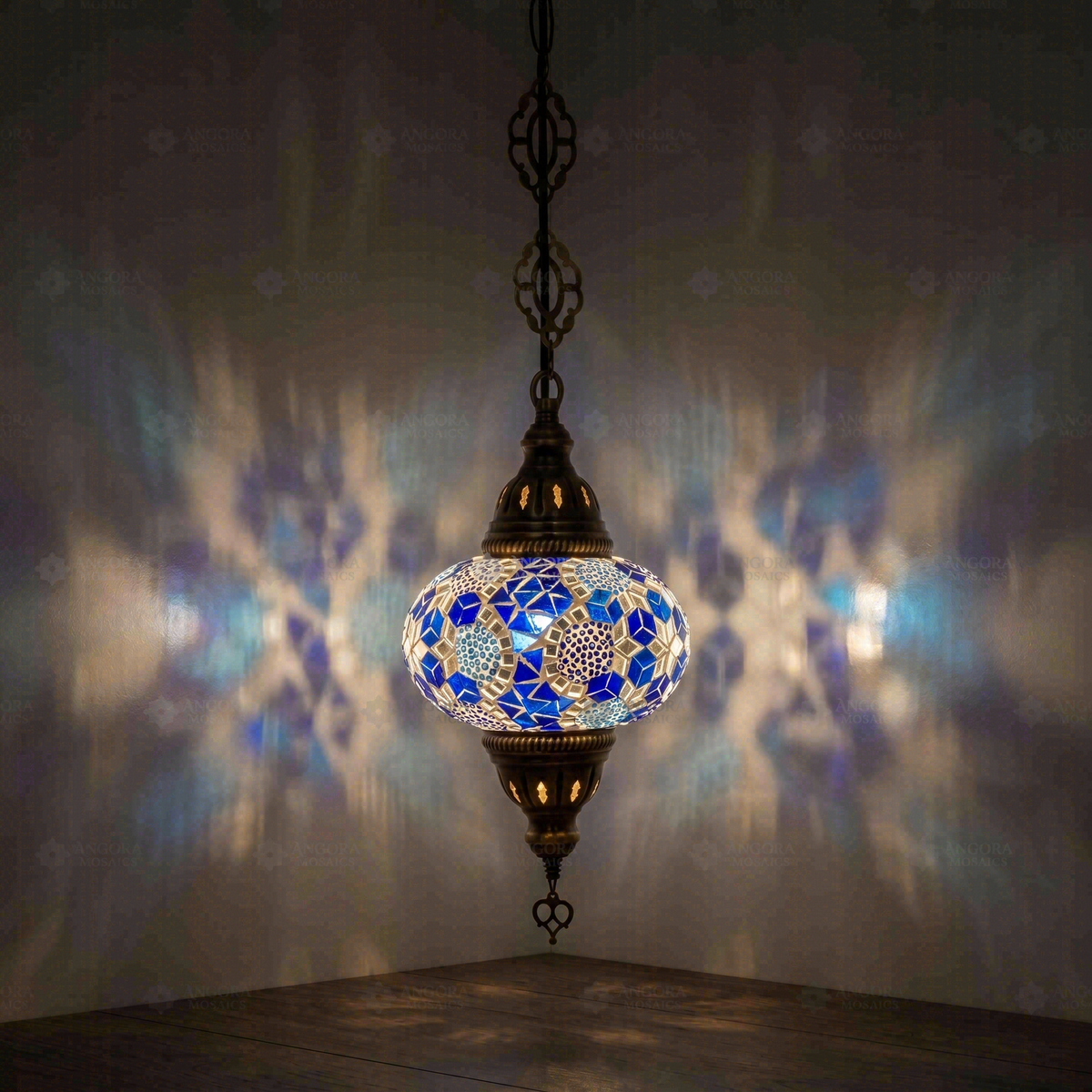 Blue Pendant Lamp, switched on, glowing in a dark room