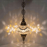 White Turkish mosaic pendant light illuminated, showing colorful light projection (ENV DYN3036)