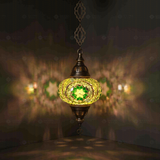 Green Turkish mosaic pendant light illuminated, showing colorful light projection (ENV DYN3050)