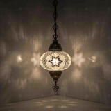 White Turkish mosaic pendant light illuminated, showing colorful light projection (ENV DYN3054)