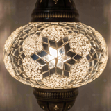 Lit close-up of mosaic glass globe — White pendant light glowing (ENV DYN3054)