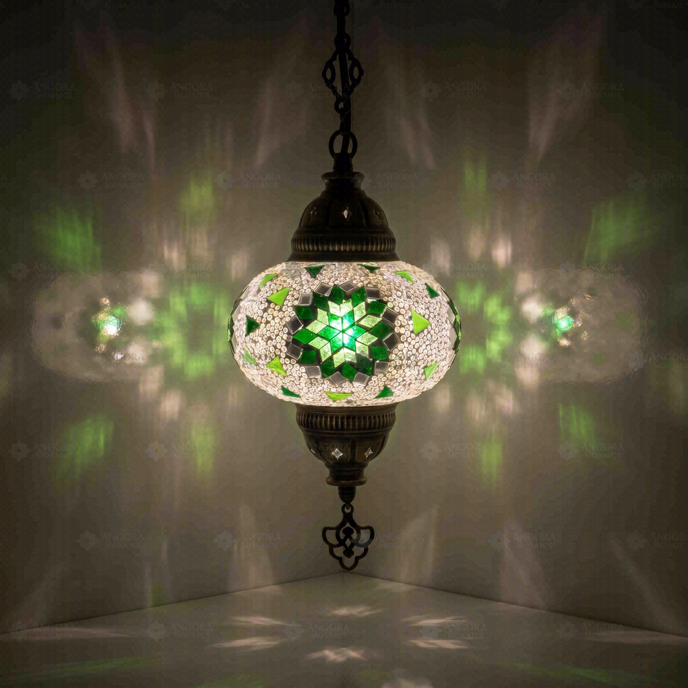Green Star Pendant Lamp, glowing in a dark room