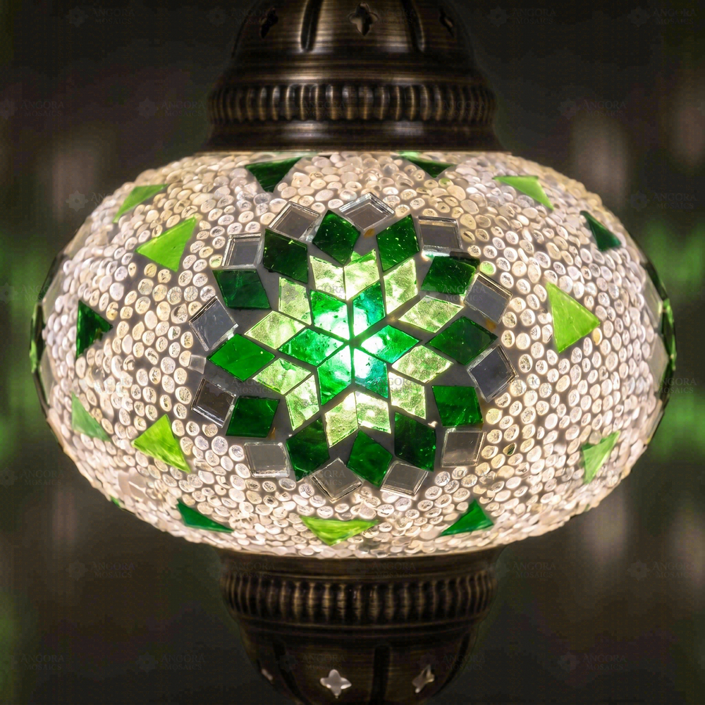 Green Star Pendant Lamp, close-up of the lit glass