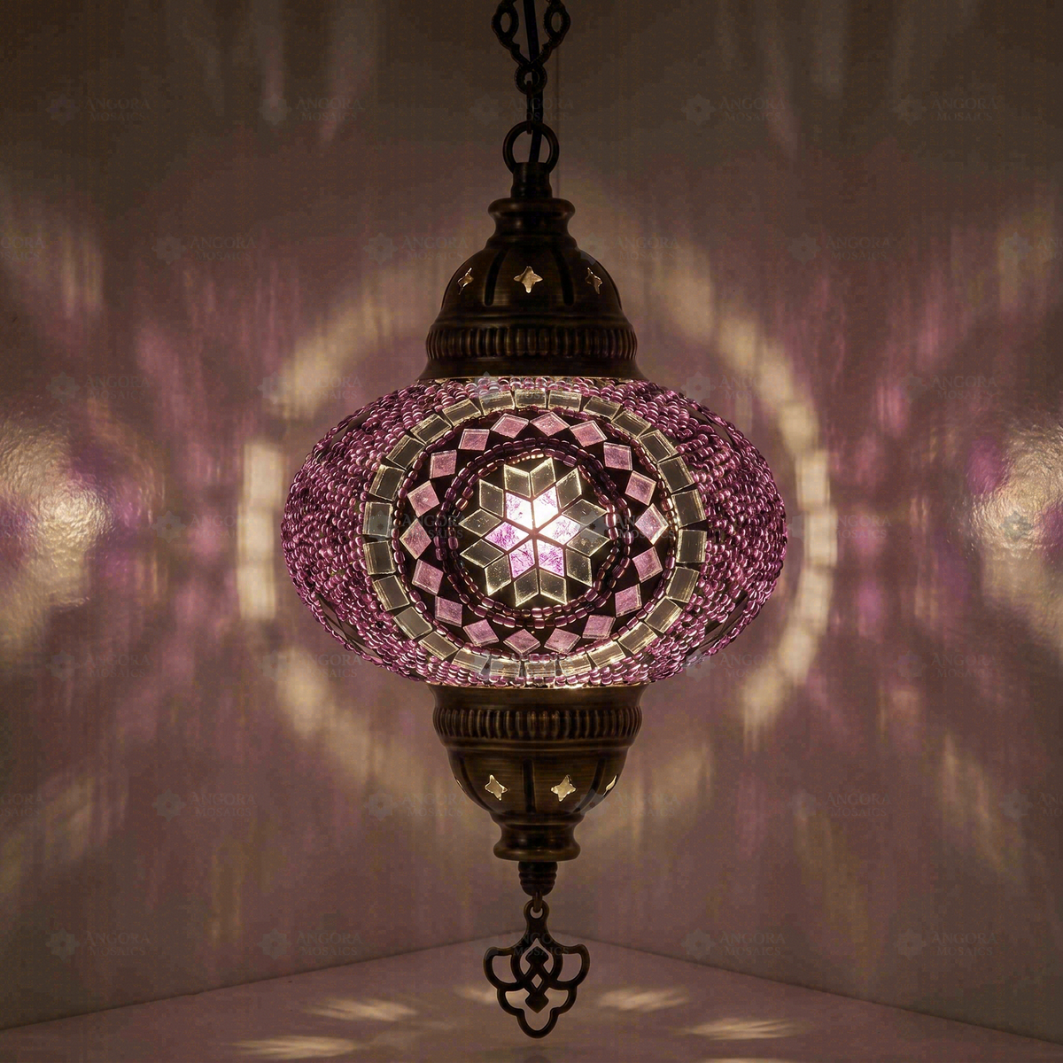 Purple Pendant Lamp, switched on, glowing in a dark room