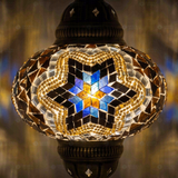 Lit close-up of mosaic glass globe — Cool Tones pendant light glowing (ENV DYN3063)