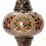 Close-up of Amber warm amber mosaic glass globe pattern — pendant light (ENV DYN3089)