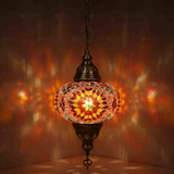 Amber Turkish mosaic pendant light illuminated, showing colorful light projection (ENV DYN3090)