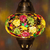 Lit close-up of mosaic glass globe — Multicolor pendant light glowing (ENV DYN3091)