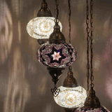 Lit close-up of mosaic glass globe — Cool Tones chandelier glowing (ENV HLZ4N3 (3019X2-3043X2))