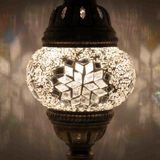 Lit close-up of mosaic glass globe — White table lamp glowing (ENV MUN1001)