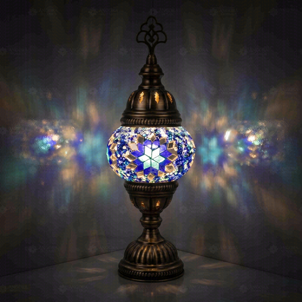 Blue Classic Table Lamp, switched on, glowing in a dark room