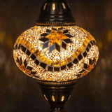 Lit close-up of mosaic glass globe — Amber table lamp glowing (ENV MUN3009)