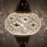 Lit close-up of mosaic glass globe — White table lamp glowing (ENV MUN3023)
