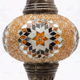 Close-up of Amber warm amber mosaic glass globe pattern — table lamp (ENV MUN3026)