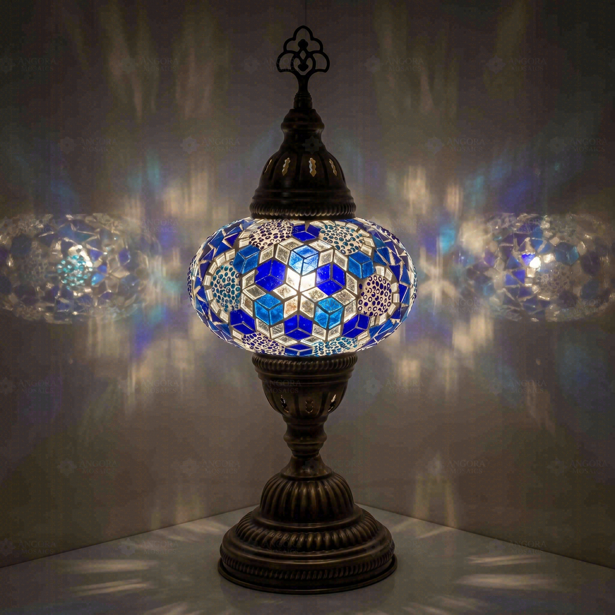 Blue Classic Table Lamp, switched on, glowing in a dark room
