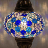 Lit close-up of mosaic glass globe — Blue table lamp glowing (ENV MUN3028)